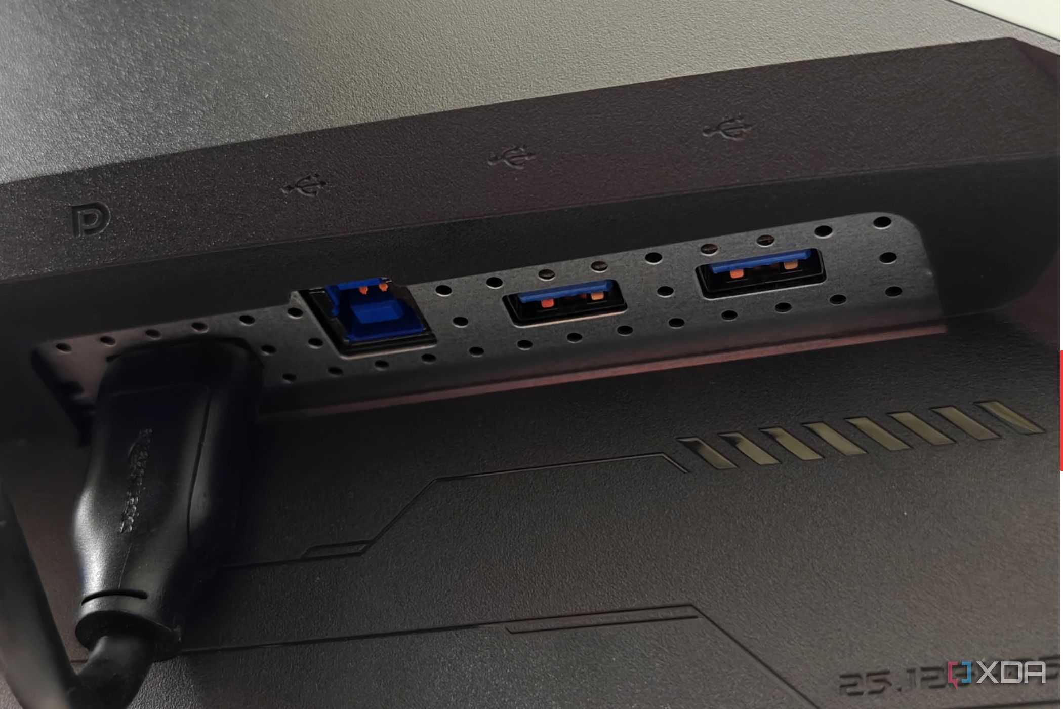 An image showing the right side ports of the Asus ROG PG27AQDM monitor.