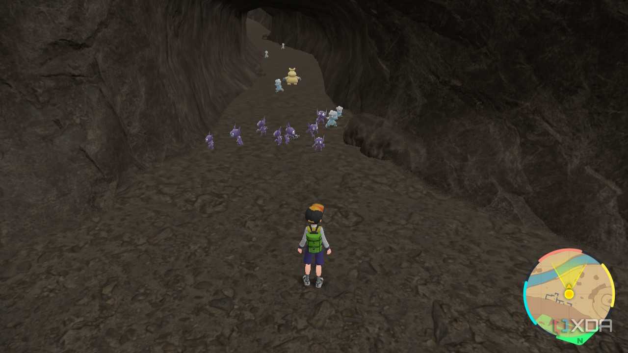 Screenshot of a Pokémon Violet showing multiple Pokémon in front of the main character