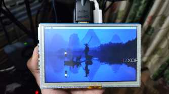 A Raspberry Pi 5 with a portable display attached to it