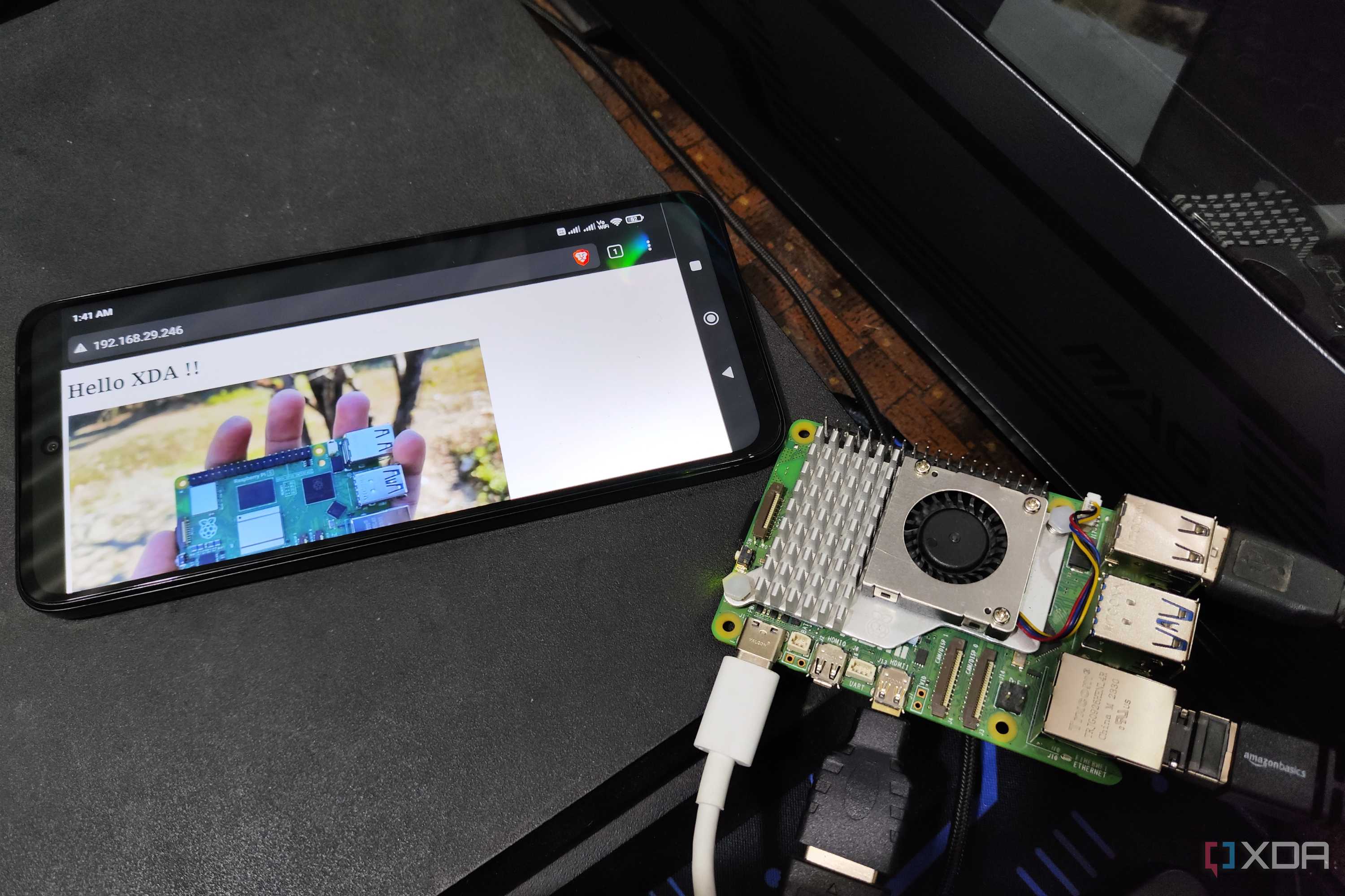A Raspberry Pi 5 placed next to a Poco M6 Pro