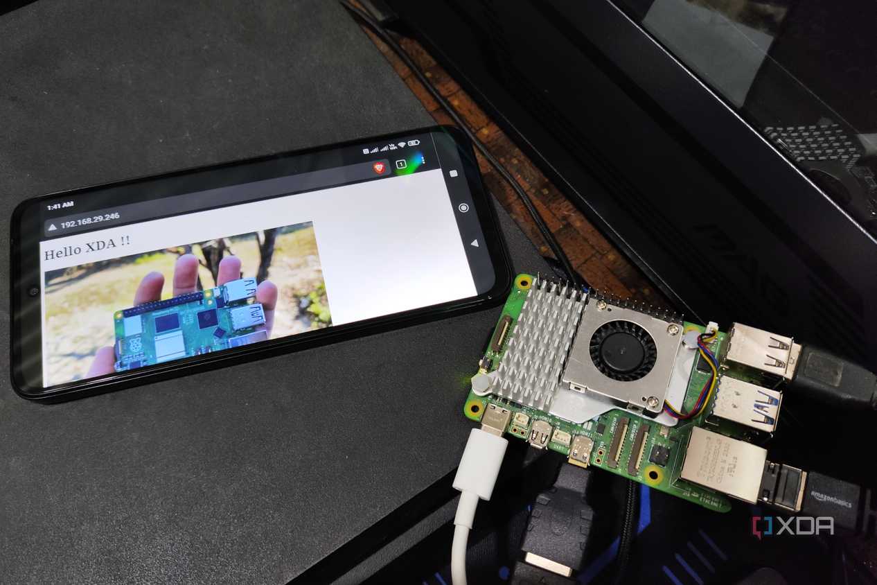 A Raspberry Pi 5 placed next to a Poco M6 Pro