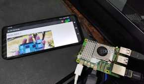 A Raspberry Pi 5 placed next to a Poco M6 Pro