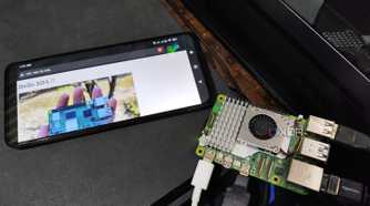 A Raspberry Pi 5 placed next to a Poco M6 Pro