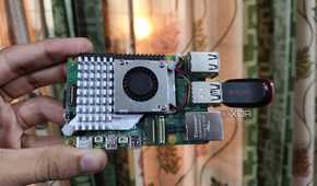 A Raspberry Pi 5 with a USB drive attached to it