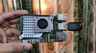 A Raspberry Pi 5 with a USB drive attached to it