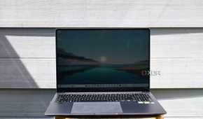 Samsung Galaxy Book 4 Ultra on stool against gray vinyl wall
