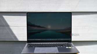 Samsung Galaxy Book 4 Ultra on stool against gray vinyl wall