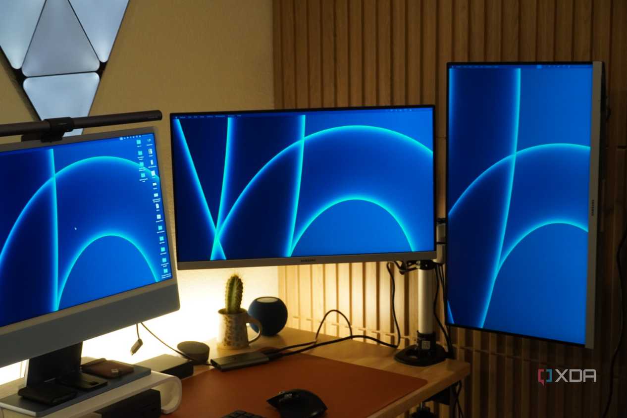 Monitors mounted on a StarTech Dual Monitor Arm.