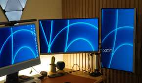 Monitors mounted on a StarTech Dual Monitor Arm.