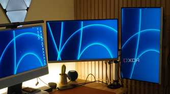 Monitors mounted on a StarTech Dual Monitor Arm.