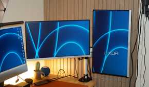 The StarTech monitor arm showing one horizontal and one vertical monitor.