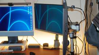 Showing the arms behind the StarTech mount.
