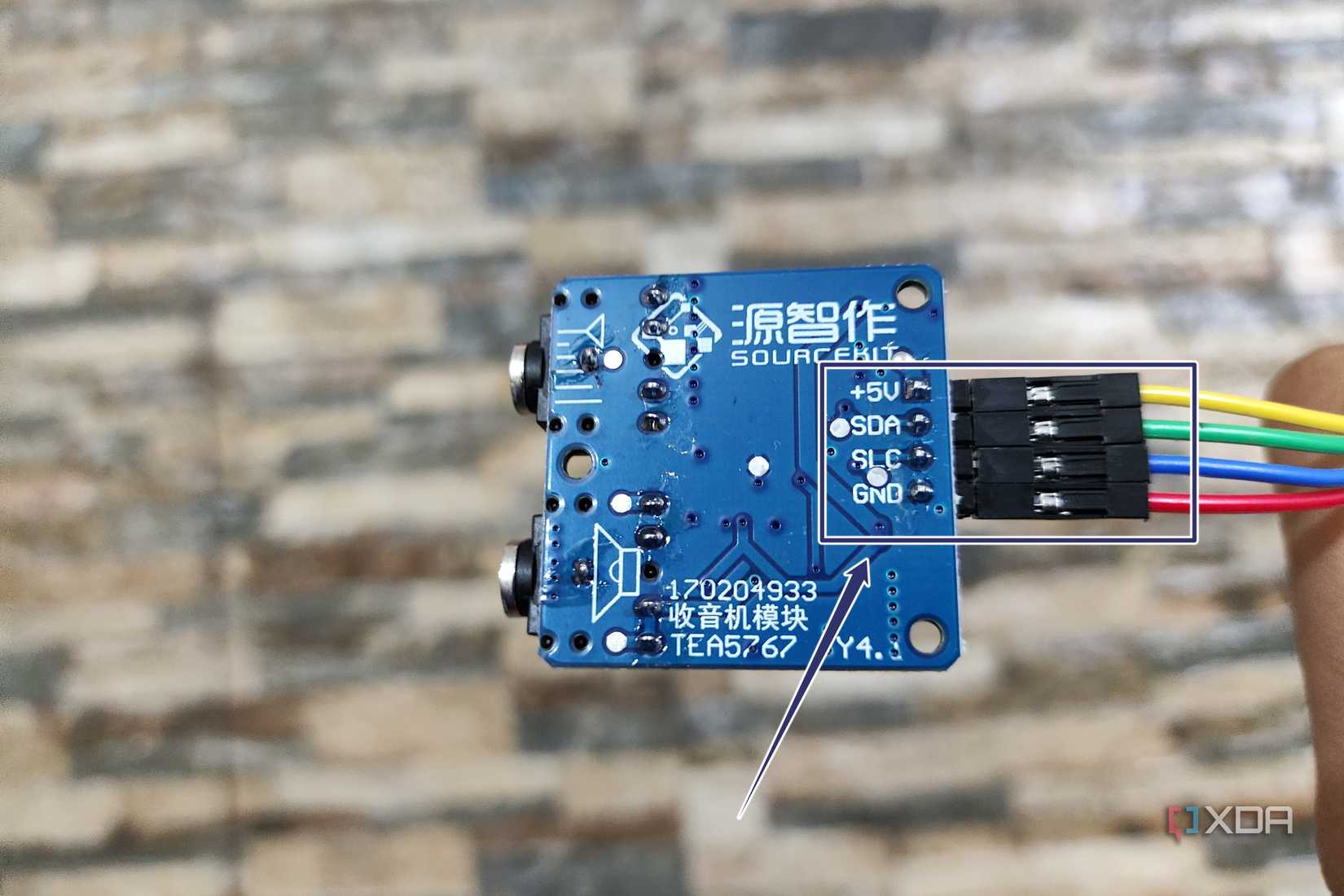 The cables plugged into the pins of a TEA5767 module