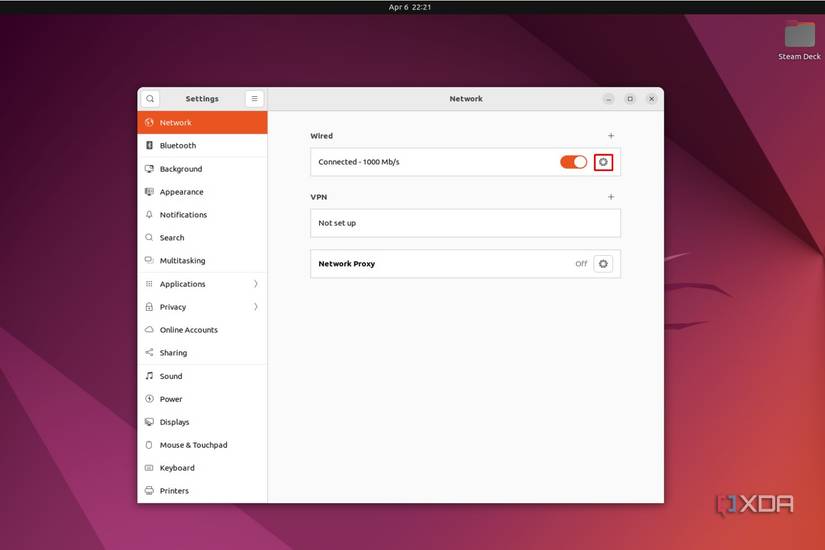 Ubuntu screenshot that highlights the Settings icon next to the wired connection in the Network page.