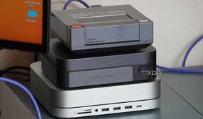 The Ugreen NAS sandwiched between an Ayaneo Mini PC and Mac Mini.