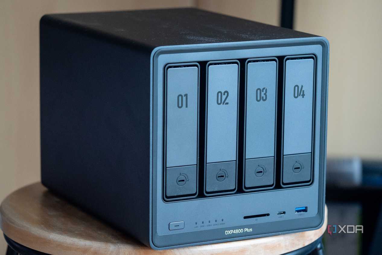 Ugreen NAS on a table, showing the four drive bays and front ports