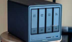 Ugreen NAS on a table, showing the four drive bays and front ports