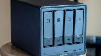 Ugreen NAS on a table, showing the four drive bays and front ports