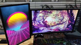 A normal monitor and a vertical monitor mounted on the same monitor arm
