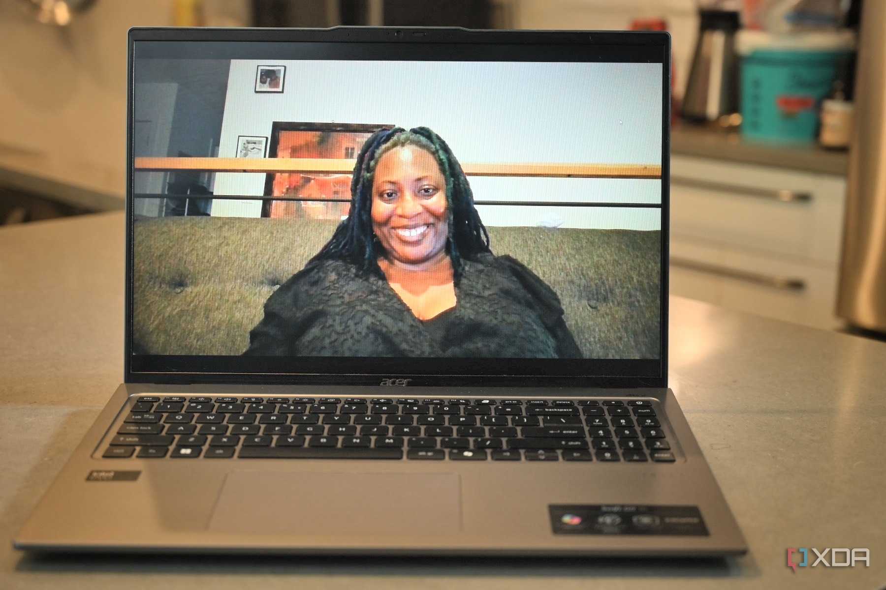 Test shot of African-American women in black lace shirt using Acer Swift Go 14 (2024)'s webcam
