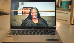 Test shot of African-American women in black lace shirt using Acer Swift Go 14 (2024)'s webcam