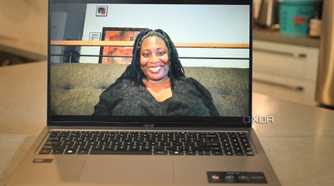 Test shot of African-American women in black lace shirt using Acer Swift Go 14 (2024)'s webcam