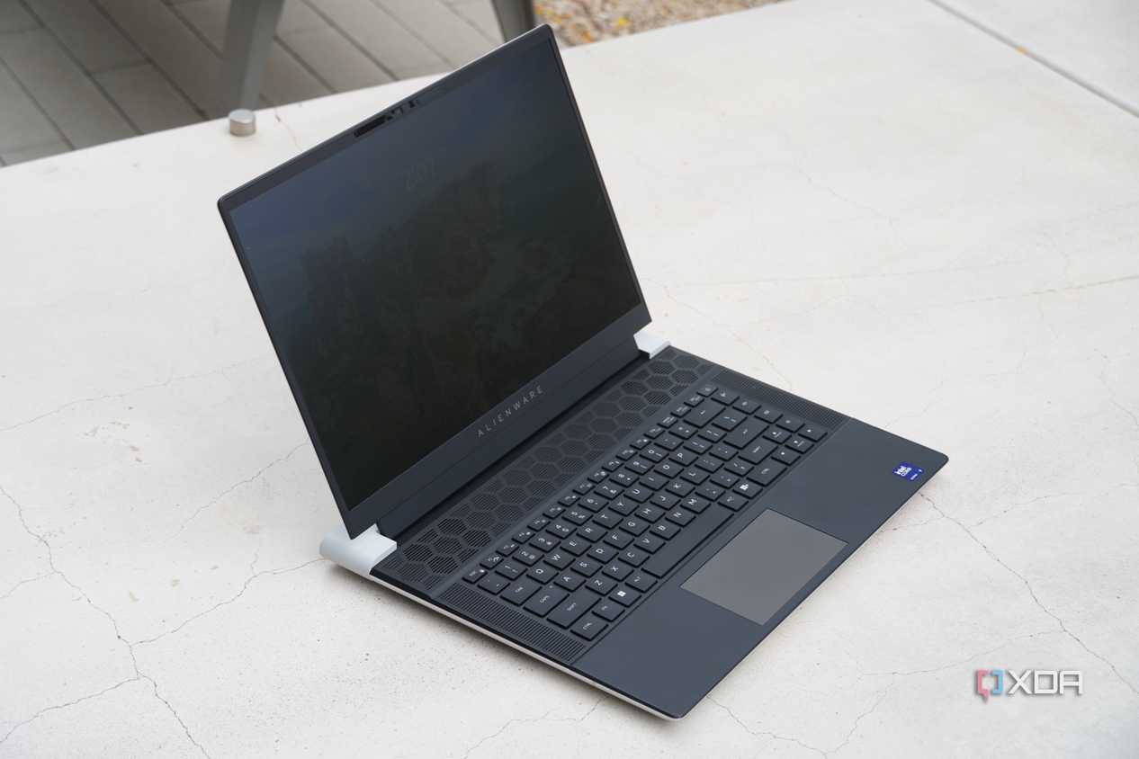 The Alienware x16 R2 on a concrete barrier.