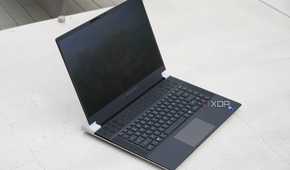 The Alienware x16 R2 on a concrete barrier.