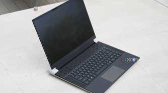 The Alienware x16 R2 on a concrete barrier.