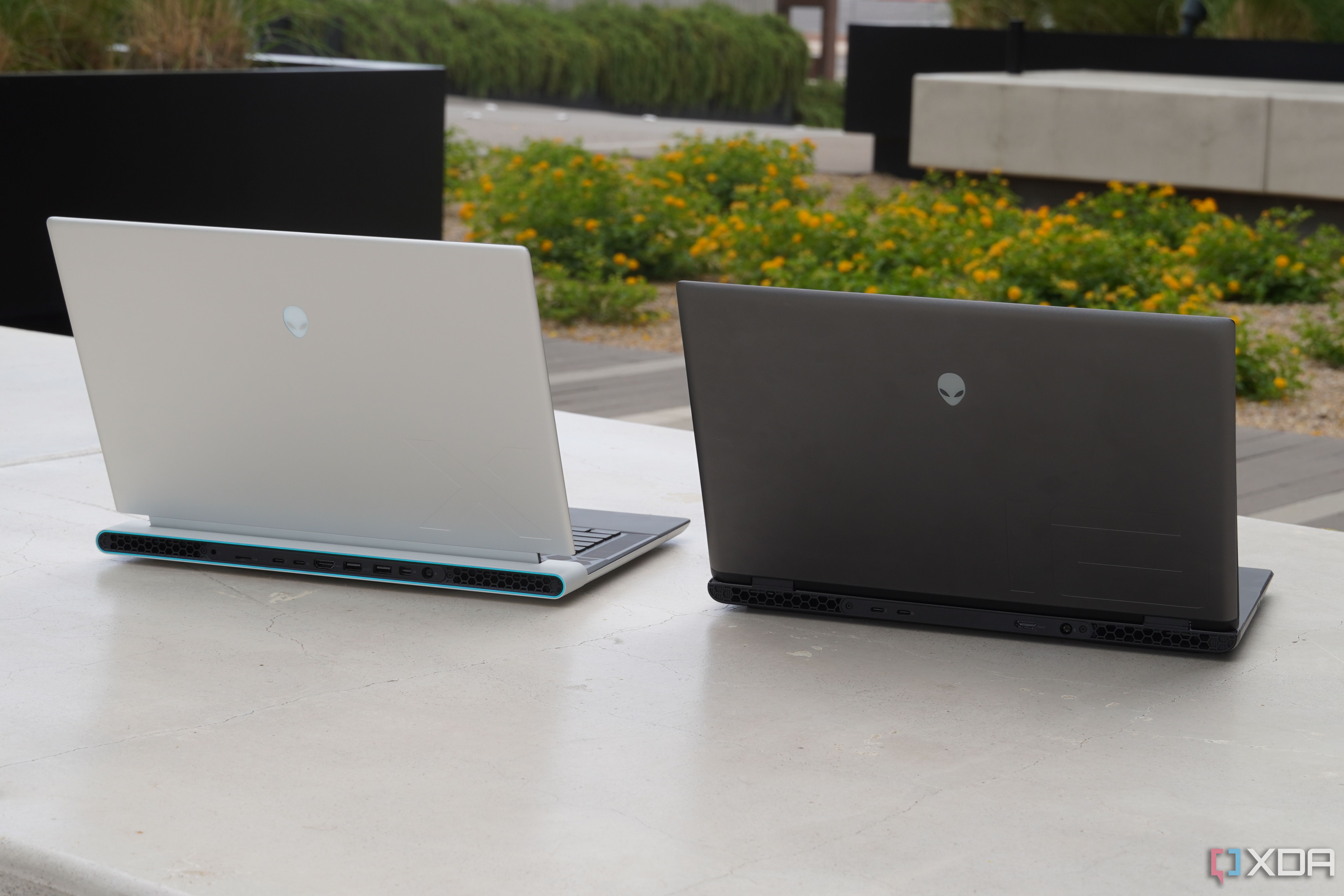 An Alienware x16 R2 (left) beside an Alienware m16 R2 (right).