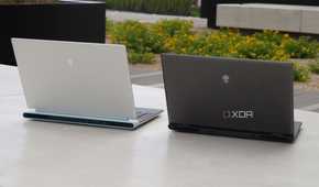 An Alienware x16 R2 (left) beside an Alienware m16 R2 (right).