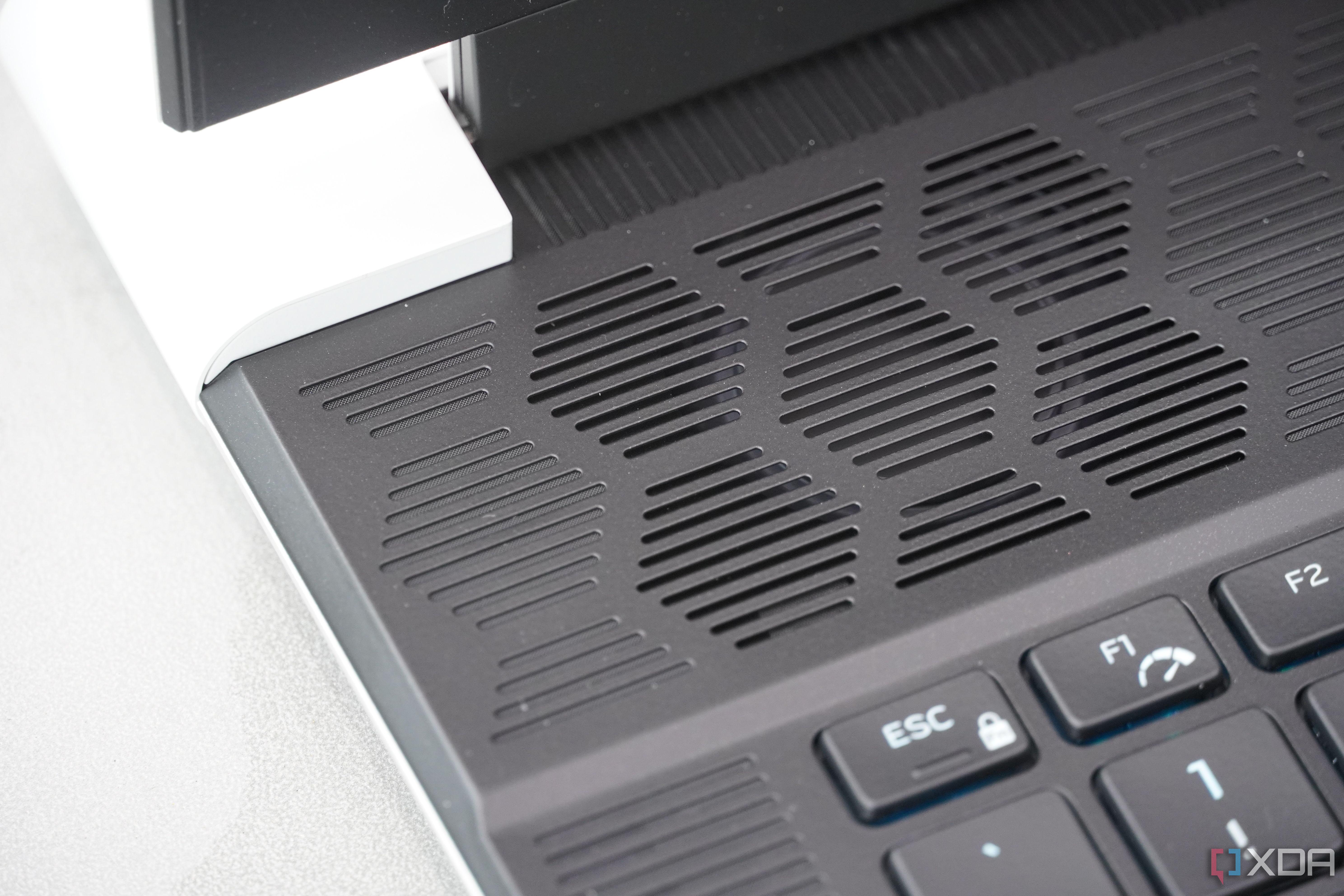 The exam key and cooling system on the Alienware x16 R2.