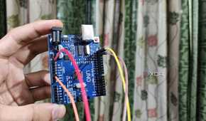 An Arduino Uno with Jumper cables plugged in