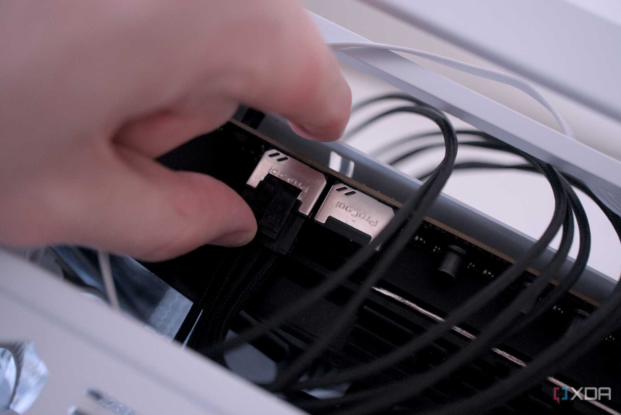 Attaching the CPU power cables inside the be quiet! Dark Base 701