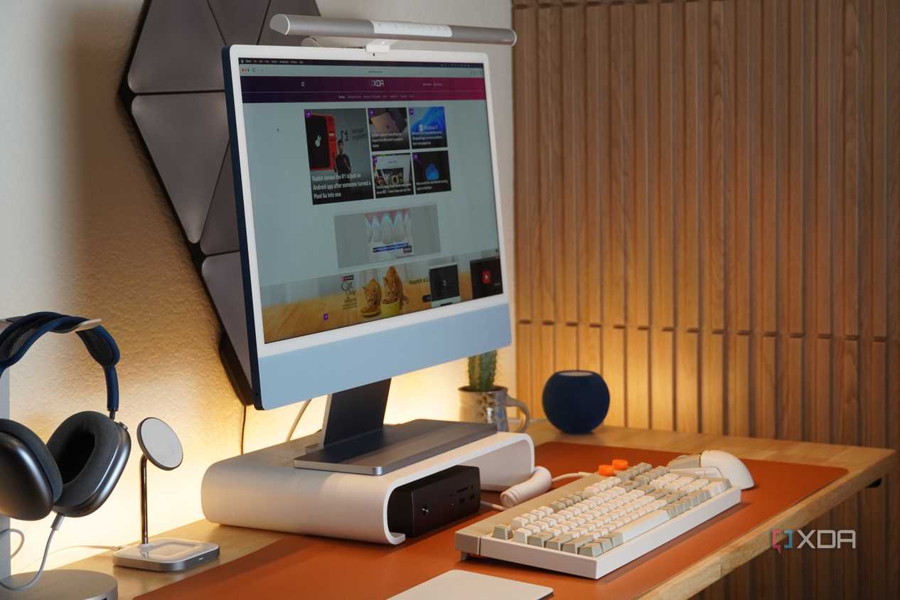 A desk setup featuring the BenQ ScreenBar Pro.