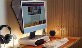 A desk setup featuring the BenQ ScreenBar Pro.