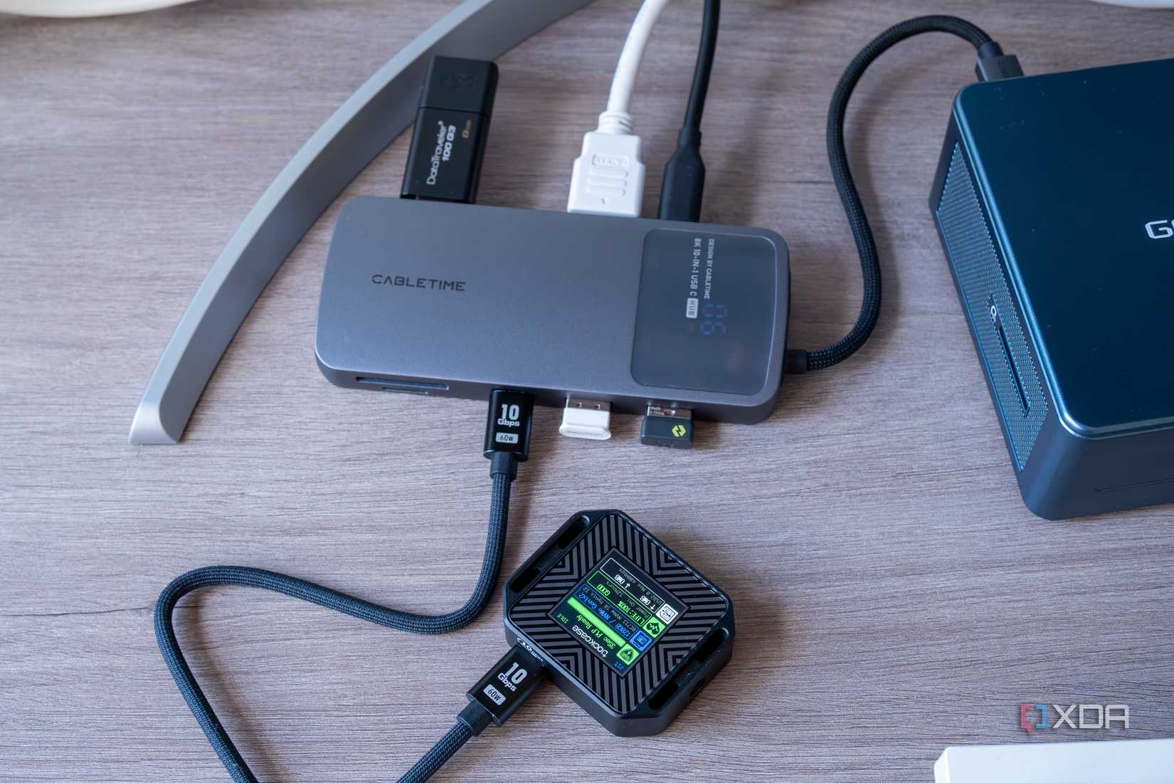 A Cabletime 10-in-1 8K USB-C Hub Digital Display with an external SSD connected indicating that speeds are limited to USB 2.0