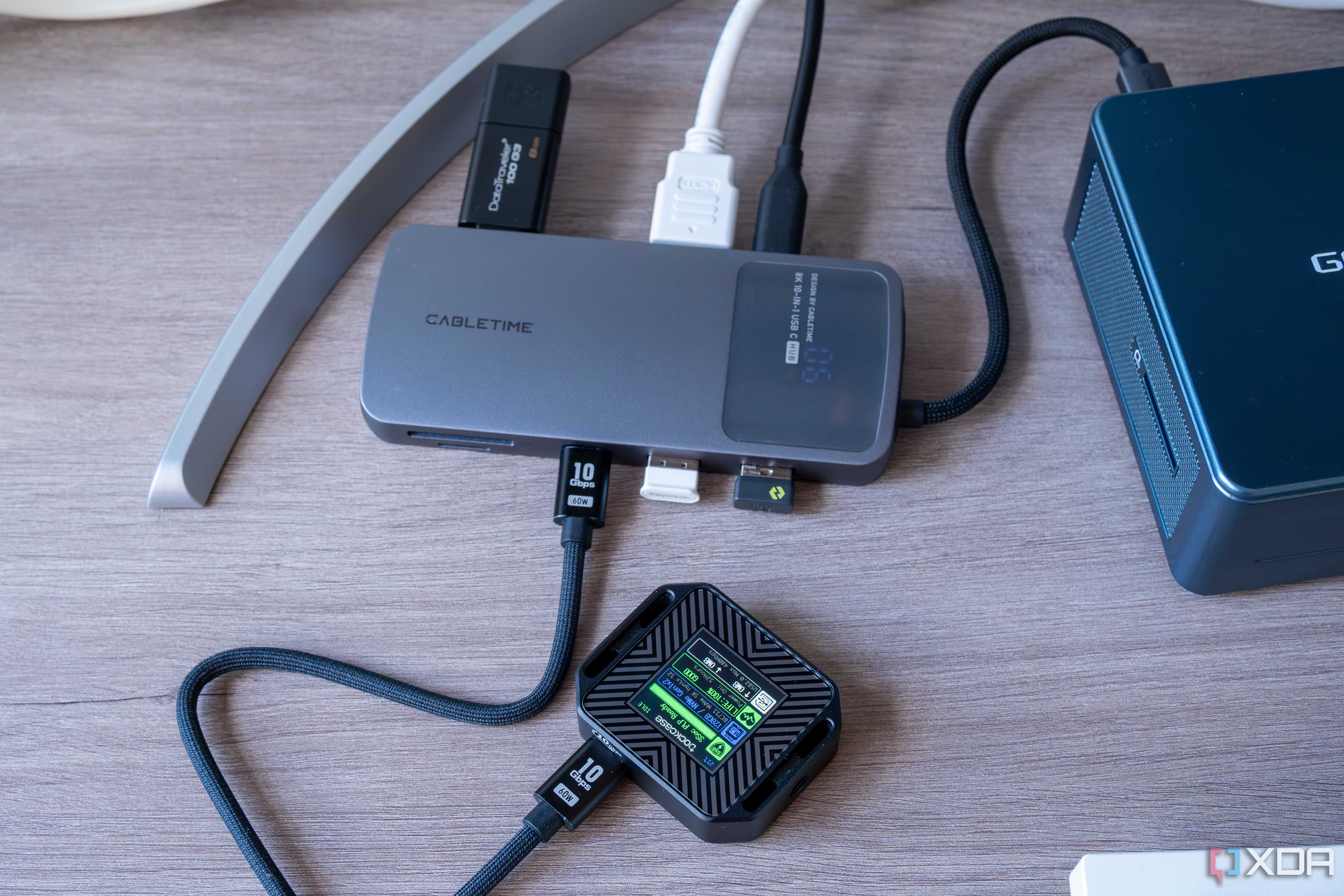 A Cabletime 10-in-1 8K USB-C Hub Digital Display with an external SSD connected indicating that speeds are limited to USB 2.0