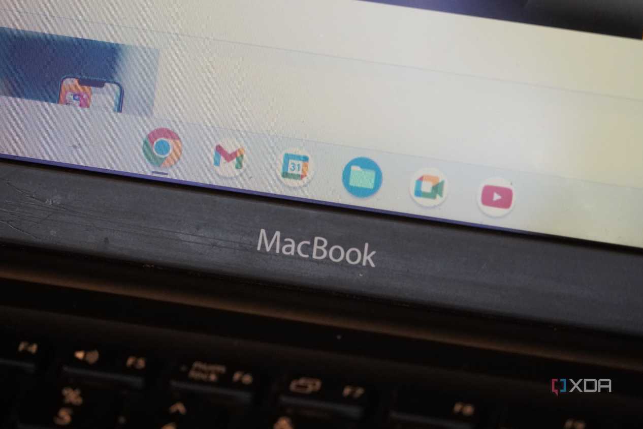 The ChromeOS dock above the MacBook text.