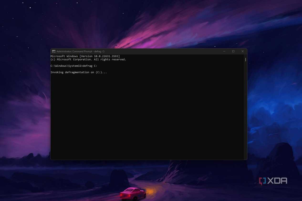 Windows 11 command prompt screenshot that shows the defrag command in action