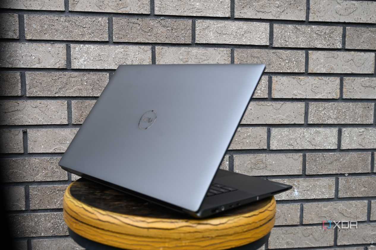 Dell Precision 5690 taken from side against brick wall