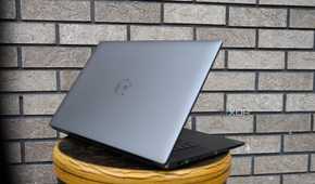 Dell Precision 5690 taken from side against brick wall