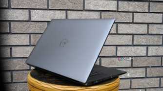 Dell Precision 5690 taken from side against brick wall