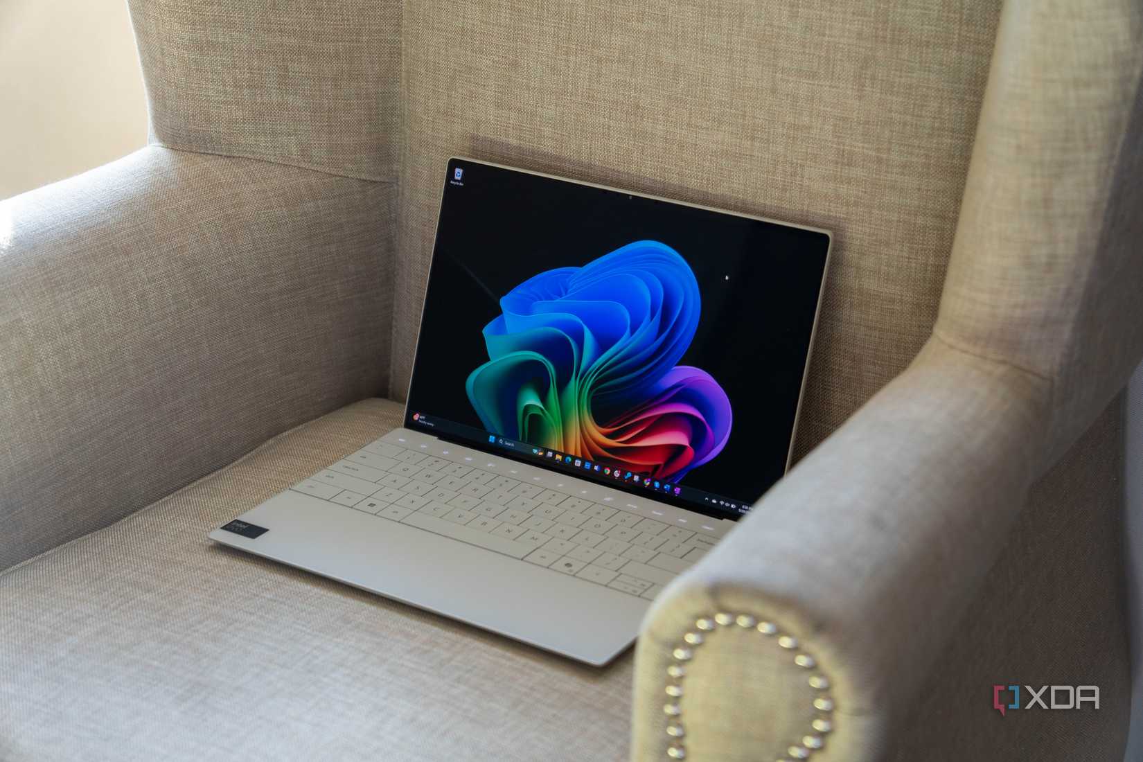 Angled view of Dell XPS 13 on an armchair