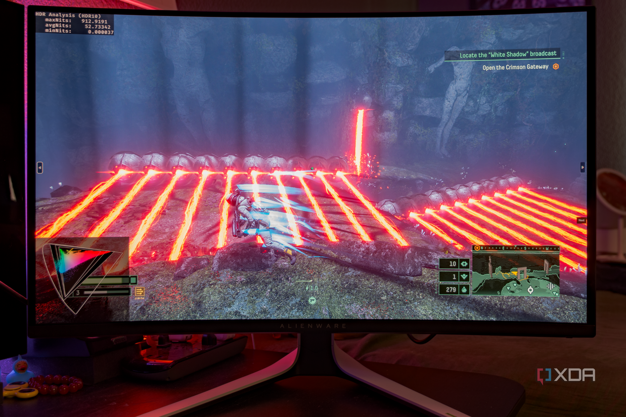 A game with vibrant colors being shown on the Dell AW3225QF.