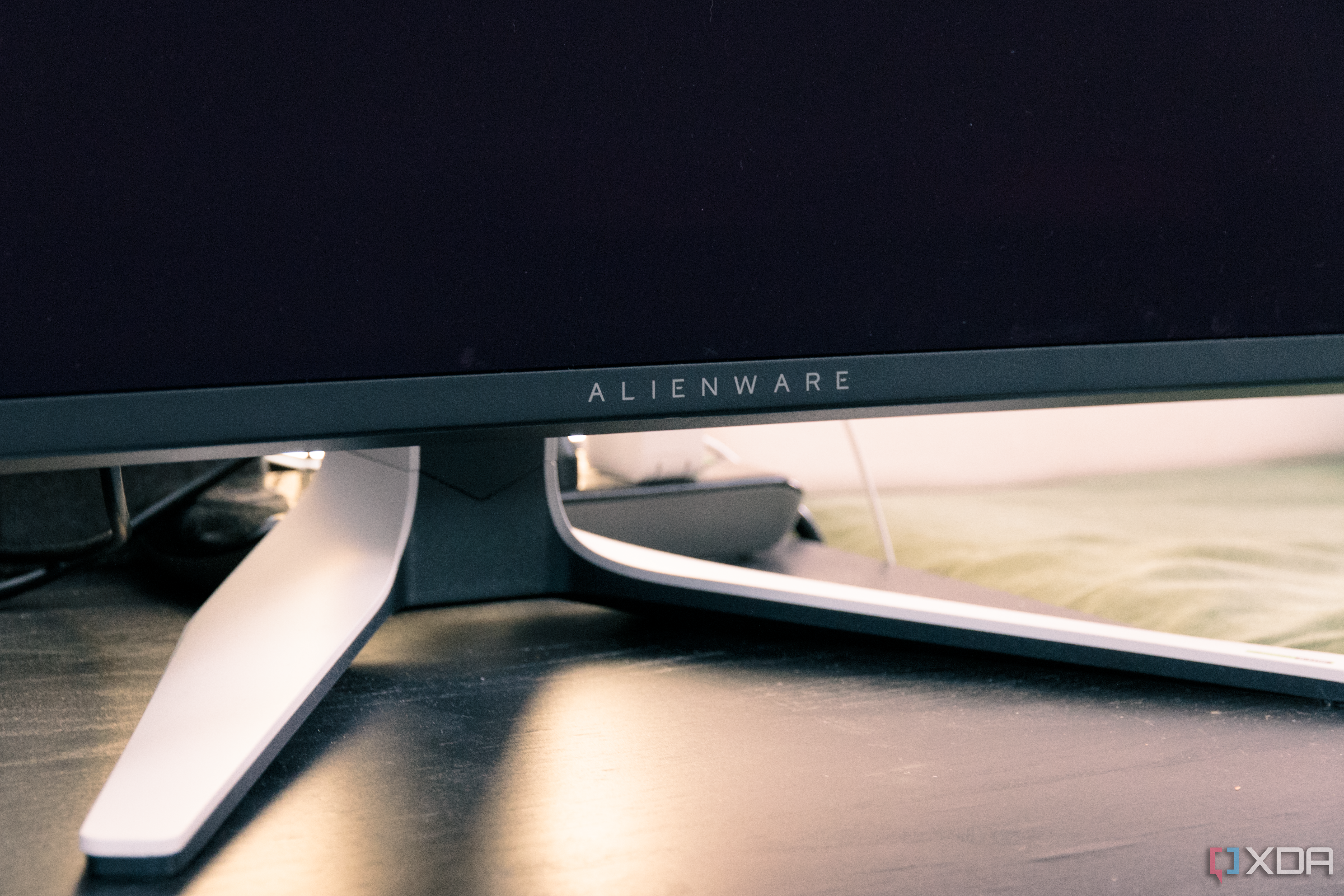 The logo on the chin of the Dell AW3225QF.