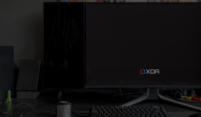 A black level comparison between the Dell AW3225QF and the LG C2 in dim lighting.
