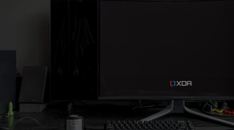 A black level comparison between the Dell AW3225QF and the LG C2 in dim lighting.