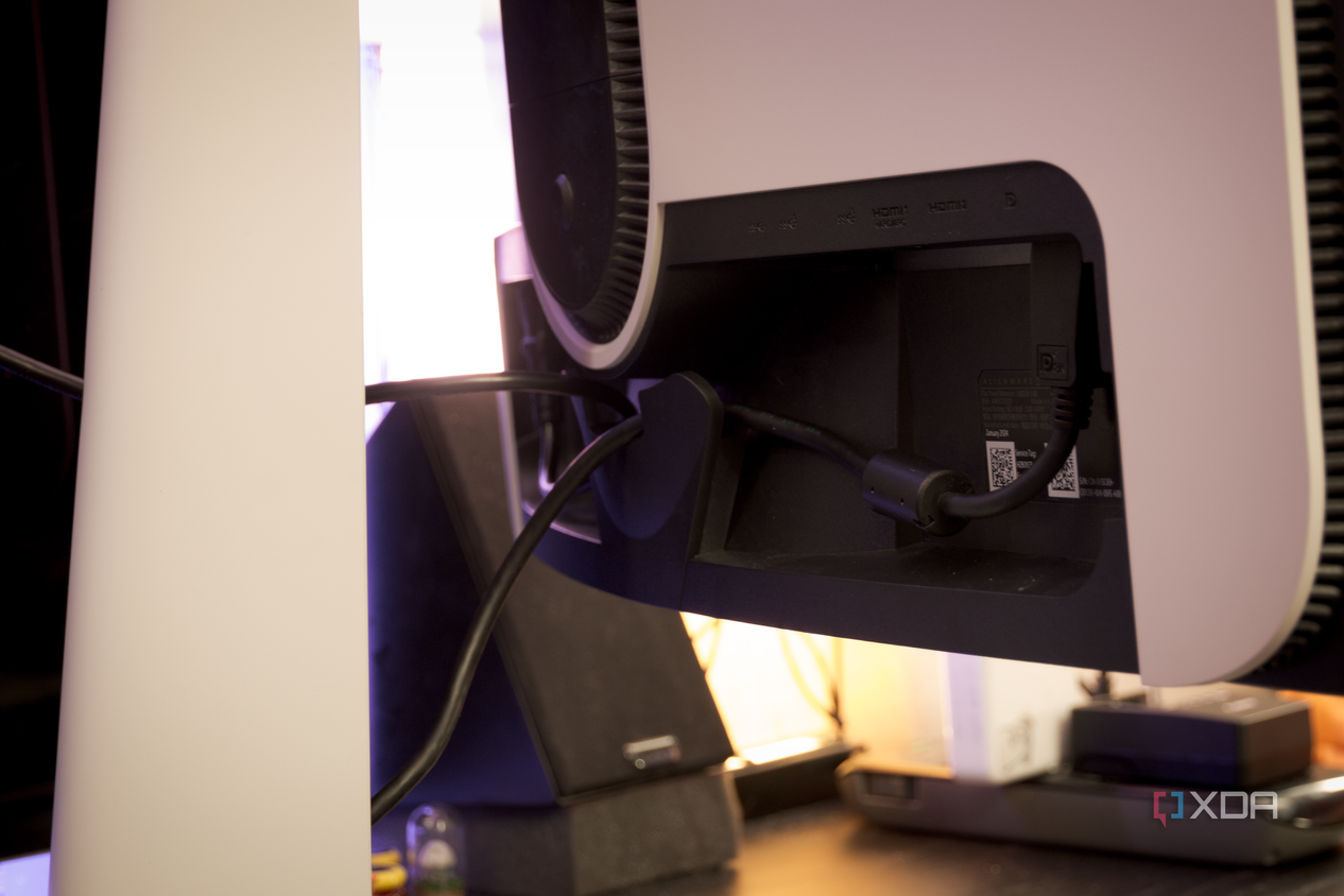 The rear cable holder of the Dell AW3225QF.