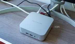 Angled view of the Geekom A8 mini PC with multiple peripherals connected